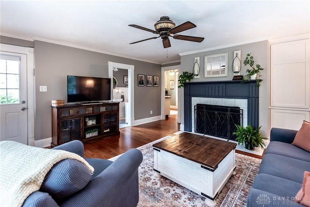206 Wright Ave, Lebanon, OH 45036 - living room with a ceiling fan, wood finished floors, a fireplace, baseboards, and ornamental molding