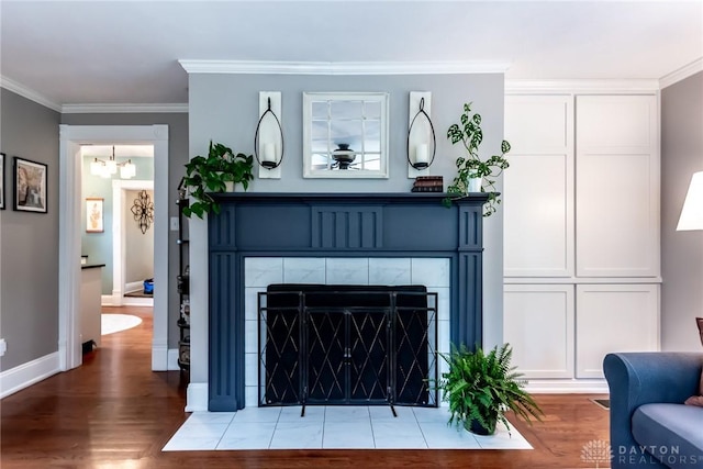 206 Wright Ave, Lebanon, OH 45036 - detailed view of wood finished floors, ornamental molding, baseboards, a chandelier, and a fireplace