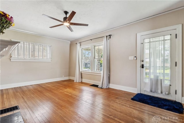 303 Hadley Ave, Oakwood, OH 45419 - entryway with wood-type flooring, ceiling fan, baseboards, and crown molding