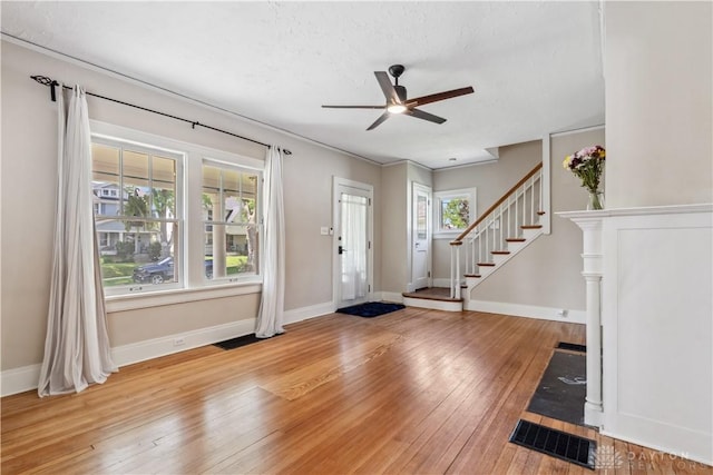 303 Hadley Ave, Oakwood, OH 45419 - entrance foyer featuring light wood-type flooring, a ceiling fan, baseboards, and stairway