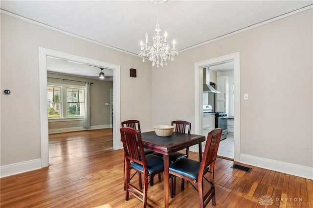 303 Hadley Ave, Oakwood, OH 45419 - dining room featuring ornamental molding, a chandelier, light wood-style floors, and baseboards