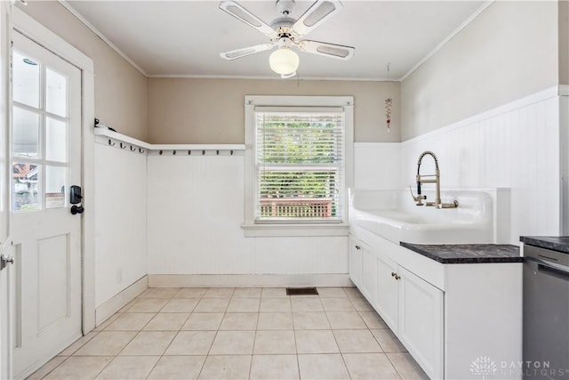303 Hadley Ave, Oakwood, OH 45419 - kitchen with white cabinets, ceiling fan, ornamental molding, dark countertops, and light tile patterned floors