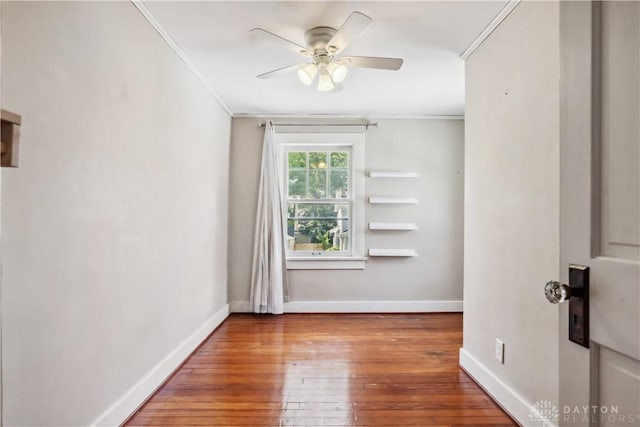 303 Hadley Ave, Oakwood, OH 45419 - spare room featuring crown molding, hardwood / wood-style flooring, baseboards, and a ceiling fan