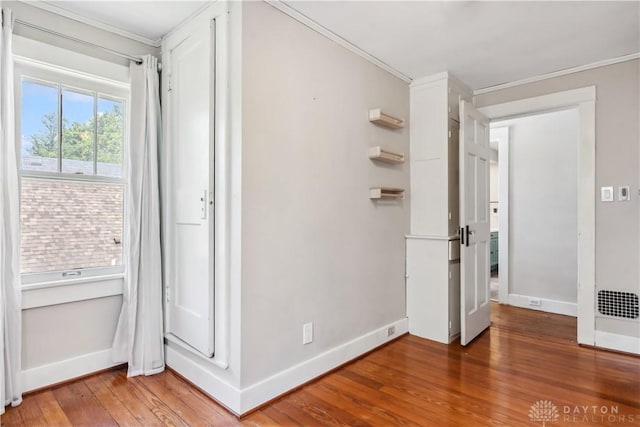 303 Hadley Ave, Oakwood, OH 45419 - unfurnished bedroom with baseboards, hardwood / wood-style floors, and ornamental molding