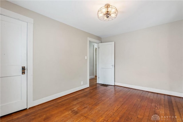 303 Hadley Ave, Oakwood, OH 45419 - empty room with baseboards and wood-type flooring