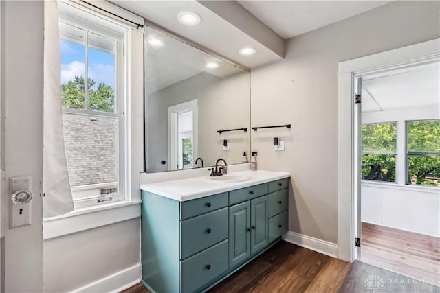 303 Hadley Ave, Oakwood, OH 45419 - bathroom featuring baseboards, vanity, wood finished floors, and recessed lighting