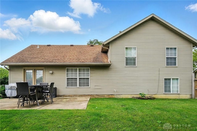 432 Applegate Rd, Englewood, OH 45322 - back of house featuring a patio, a lawn, and roof with shingles