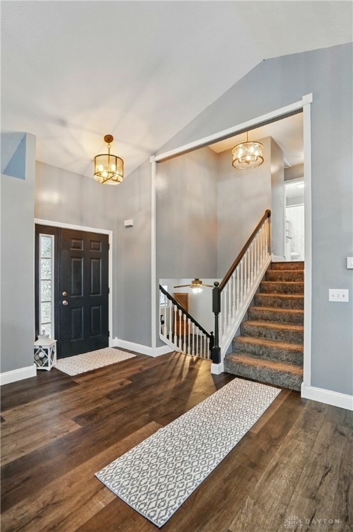 432 Applegate Rd, Englewood, OH 45322 - foyer with a chandelier, wood finished floors, stairway, and vaulted ceiling
