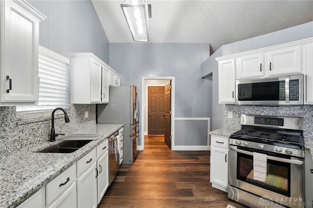 432 Applegate Rd, Englewood, OH 45322 - kitchen with appliances with stainless steel finishes, a sink, white cabinets, dark wood-style flooring, and backsplash