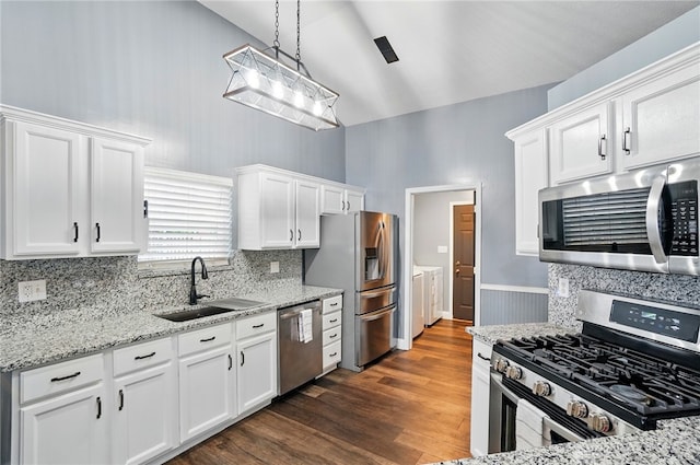 432 Applegate Rd, Englewood, OH 45322 - kitchen featuring stainless steel appliances, a sink, high vaulted ceiling, white cabinetry, and dark wood-style floors