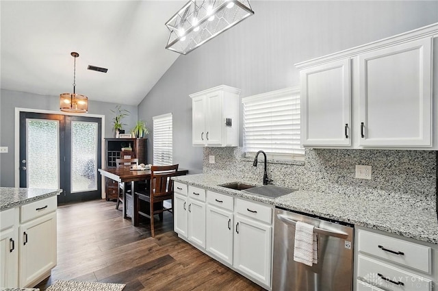 432 Applegate Rd, Englewood, OH 45322 - kitchen with dishwasher, a sink, vaulted ceiling, backsplash, and dark wood-style flooring