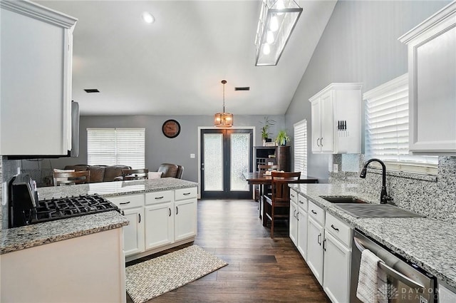 432 Applegate Rd, Englewood, OH 45322 - kitchen featuring stainless steel dishwasher, a sink, backsplash, range, and plenty of natural light