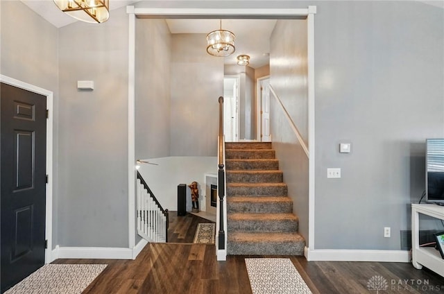 432 Applegate Rd, Englewood, OH 45322 - foyer with a chandelier, wood finished floors, stairway, and baseboards