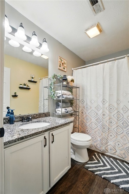432 Applegate Rd, Englewood, OH 45322 - bathroom with wood finished floors, vanity, and toilet