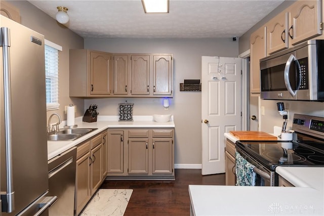 3008 Clearstream Way, Clayton, OH 45315 - kitchen featuring appliances with stainless steel finishes, a sink, light countertops, dark wood-type flooring, and baseboards