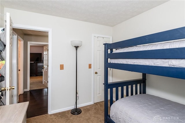 3008 Clearstream Way, Clayton, OH 45315 - carpeted bedroom with baseboards and a textured ceiling