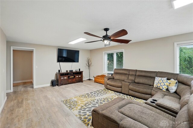 3835 Polo Trace Ct, Bellbrook, OH 45305 - living room featuring light wood-style flooring, a ceiling fan, and baseboards