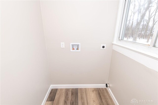 4370 Dayton Liberty Rd, Dayton, OH 45417 - laundry area featuring washer hookup, hookup for an electric dryer, wood finished floors, and baseboards