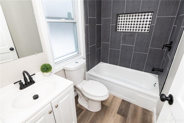 4370 Dayton Liberty Rd, Dayton, OH 45417 - full bathroom with vanity, toilet, wood finished floors, and  shower combination