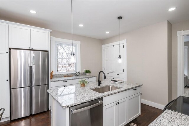 4370 Dayton Liberty Rd, Dayton, OH 45417 - kitchen with appliances with stainless steel finishes, a sink, dark wood-type flooring, white cabinets, and recessed lighting