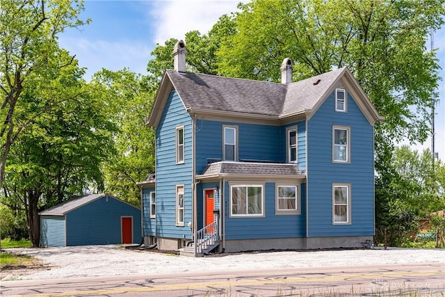 4370 Dayton Liberty Rd, Dayton, OH 45417 - view of front of home featuring entry steps, a chimney, an outdoor structure, and a shingled roof