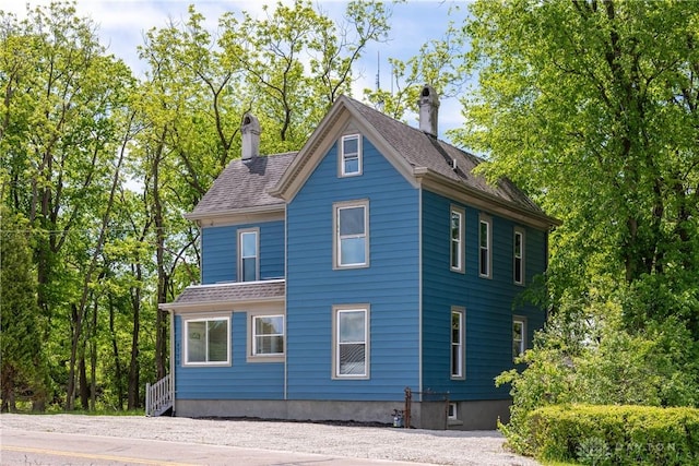 4370 Dayton Liberty Rd, Dayton, OH 45417 - view of side of home with a chimney