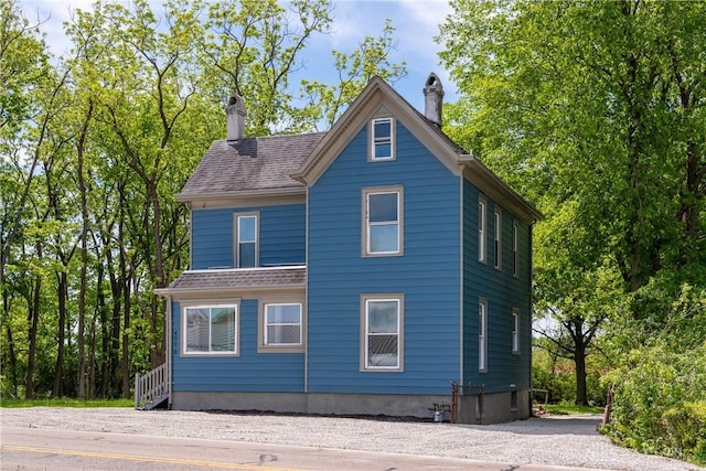 4370 Dayton Liberty Rd, Dayton, OH 45417 - view of side of home featuring a chimney