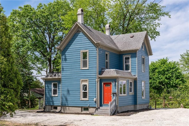 4370 Dayton Liberty Rd, Dayton, OH 45417 - view of front facade with a chimney and a shingled roof