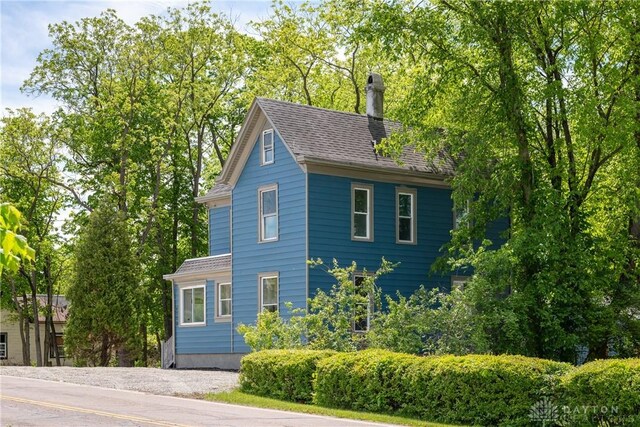 4370 Dayton Liberty Rd, Dayton, OH 45417 - view of front of house with a chimney