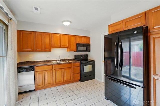 729 Clareridge Ln, Dayton, OH 45458 - kitchen featuring black appliances, a sink, dark countertops, and brown cabinetry