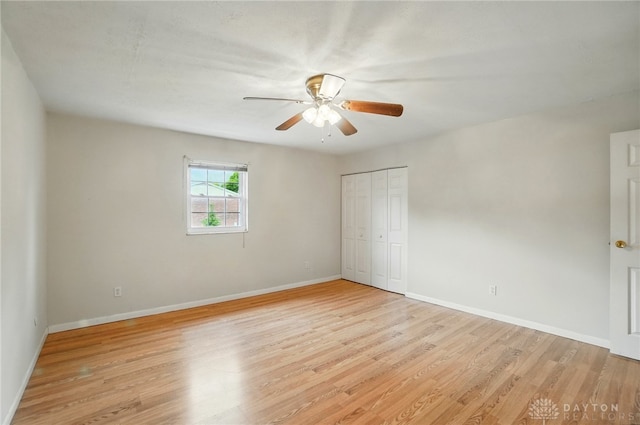 729 Clareridge Ln, Dayton, OH 45458 - unfurnished bedroom featuring light wood-type flooring, a closet, baseboards, and ceiling fan