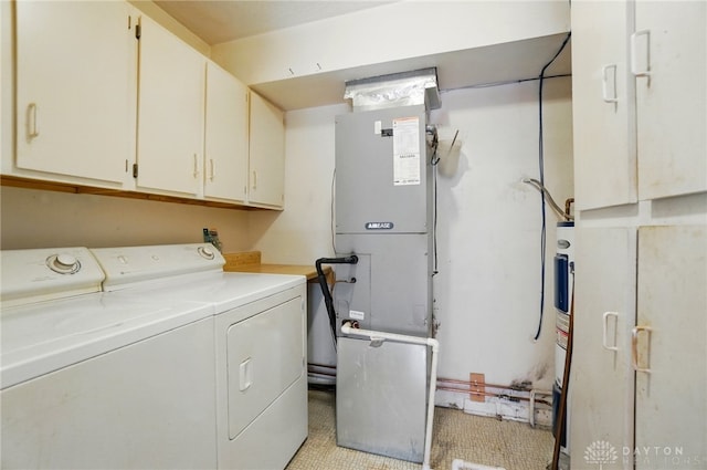 729 Clareridge Ln, Dayton, OH 45458 - washroom with cabinet space, independent washer and dryer, water heater, and heating unit