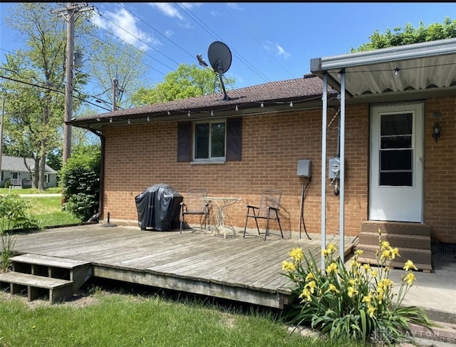 10520 Grand Vista Dr, Dayton, OH 45458 - rear view of property featuring entry steps, a wooden deck, and brick siding