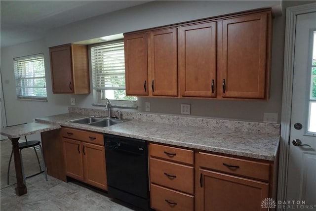 10520 Grand Vista Dr, Dayton, OH 45458 - kitchen with dishwasher, a sink, and brown cabinetry