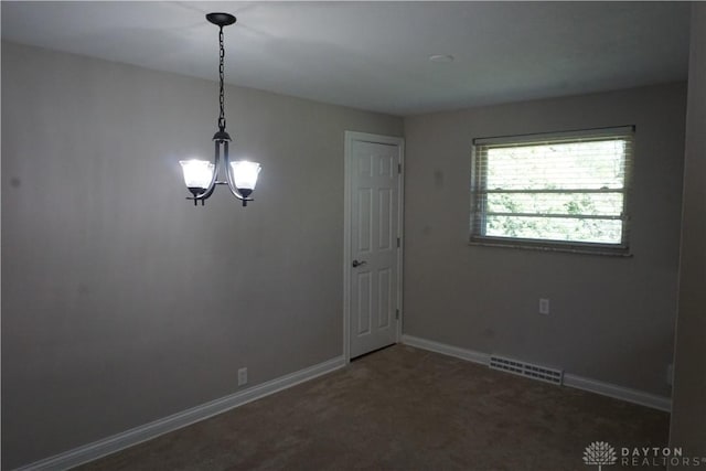 10520 Grand Vista Dr, Dayton, OH 45458 - carpeted spare room featuring a chandelier and baseboards