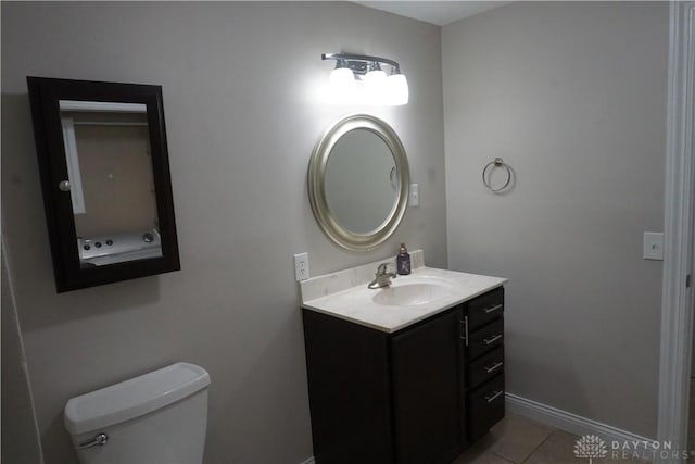 10520 Grand Vista Dr, Dayton, OH 45458 - bathroom featuring vanity, toilet, baseboards, and tile patterned flooring