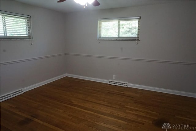 10520 Grand Vista Dr, Dayton, OH 45458 - unfurnished room featuring wood finished floors, healthy amount of natural light, ceiling fan, and baseboards