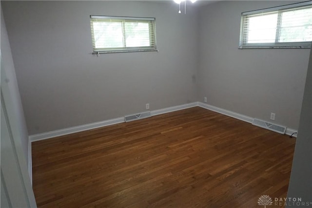 10520 Grand Vista Dr, Dayton, OH 45458 - empty room with dark wood-type flooring, baseboards, and a ceiling fan