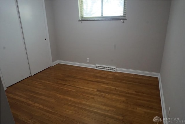 10520 Grand Vista Dr, Dayton, OH 45458 - unfurnished bedroom with wood finished floors, baseboards, and a closet
