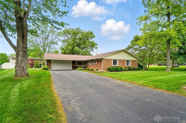 5547 Forest Bend Dr, Dayton, OH 45429 - ranch-style home featuring an attached garage, brick siding, asphalt driveway, and a front yard