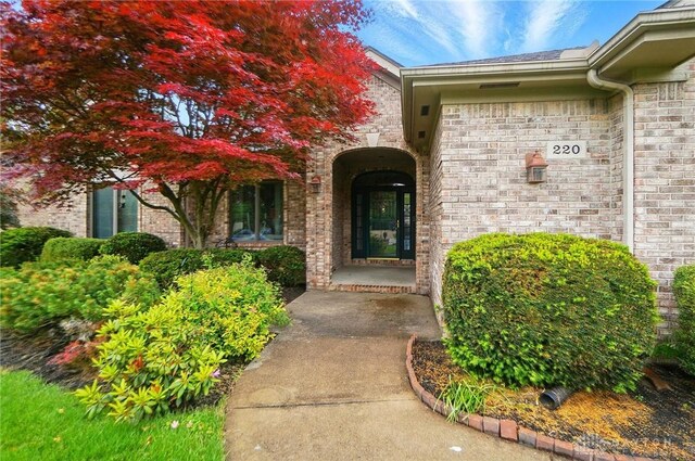 220 Fivepines Ct, Englewood, OH 45315 - doorway to property featuring brick siding