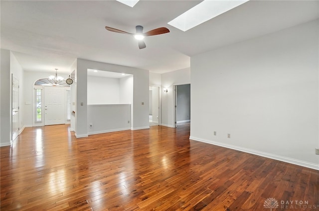 220 Fivepines Ct, Englewood, OH 45315 - empty room featuring a chandelier, a ceiling fan, a skylight, baseboards, and hardwood / wood-style floors