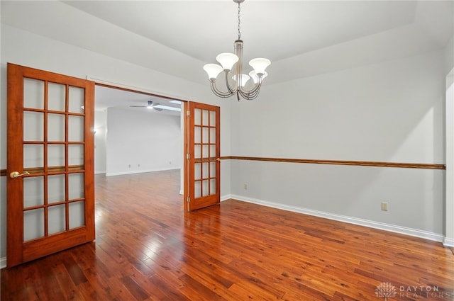 220 Fivepines Ct, Englewood, OH 45315 - unfurnished room with french doors, a chandelier, hardwood / wood-style flooring, and baseboards