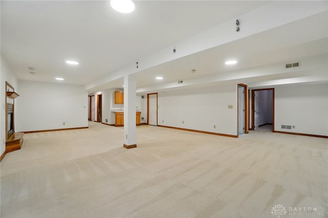 220 Fivepines Ct, Englewood, OH 45315 - finished basement featuring baseboards, light colored carpet, recessed lighting, and a fireplace