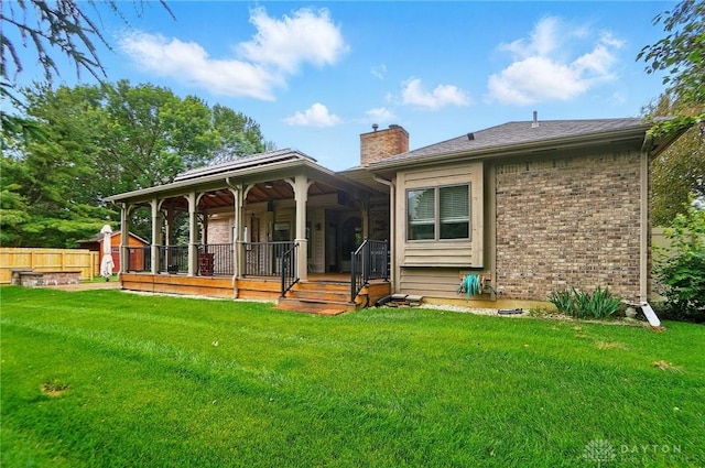 220 Fivepines Ct, Englewood, OH 45315 - back of house with a chimney, a porch, and brick siding