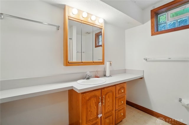 220 Fivepines Ct, Englewood, OH 45315 - bathroom with vanity, baseboards, and tile patterned floors