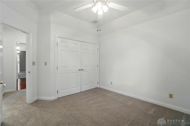 220 Fivepines Ct, Englewood, OH 45315 - unfurnished bedroom featuring carpet, baseboards, a closet, and a ceiling fan
