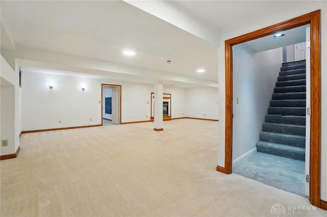 220 Fivepines Ct, Englewood, OH 45315 - finished below grade area featuring light carpet, stairs, baseboards, and recessed lighting