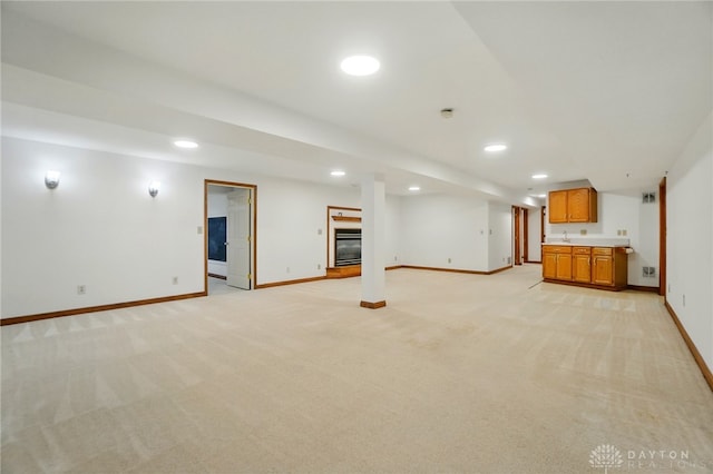 220 Fivepines Ct, Englewood, OH 45315 - unfurnished living room featuring baseboards, light colored carpet, recessed lighting, and wet bar