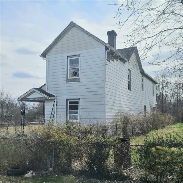 126 Arlington Ave, Dayton, OH 45417 - view of property exterior with a chimney